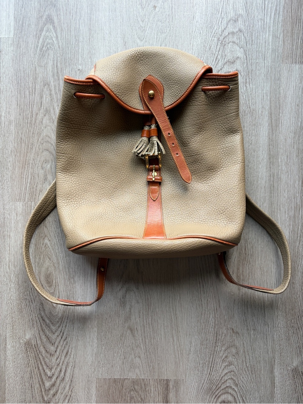 Dooney & Bourke Beige Leather Drawstring Backpack with Tan Trim